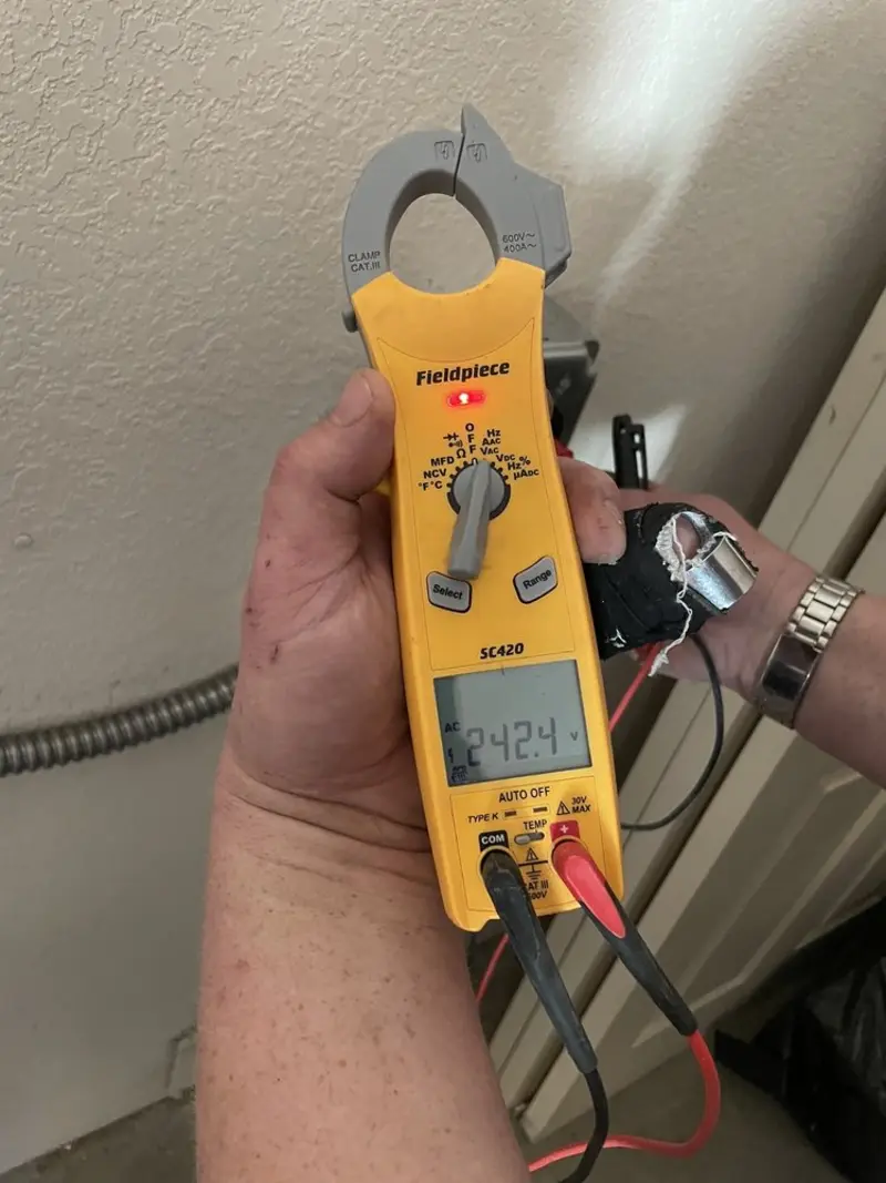 Voltage testing with clamp meter during Ceiling Fan Installation in Rainbow City